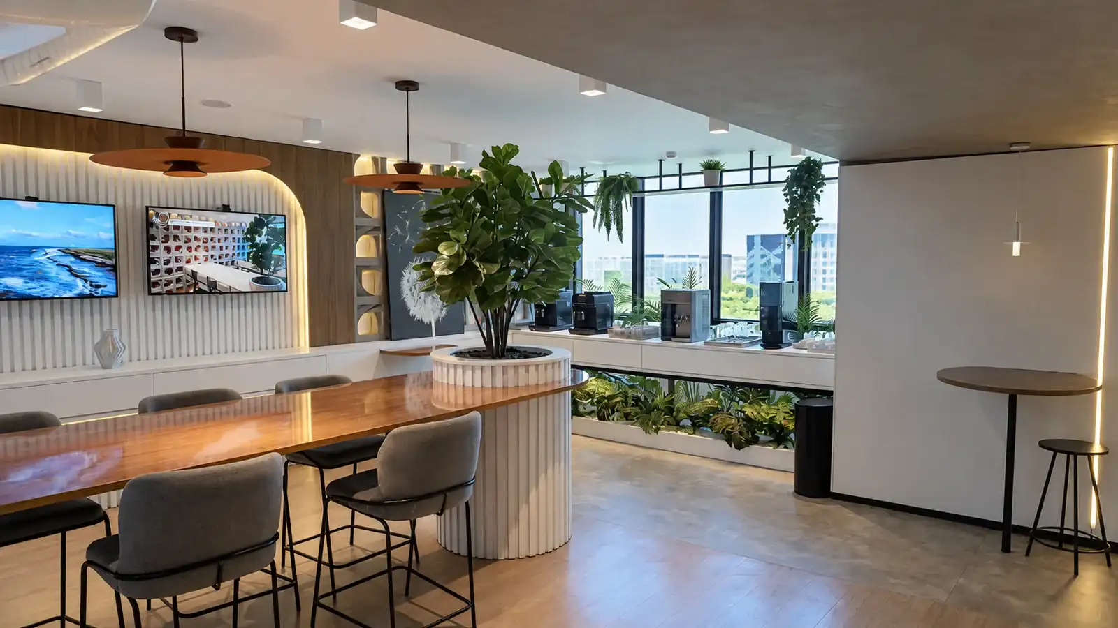 Lounge da unidade Number One da BROffices com mesas, plantas, café e janelas amplas
